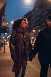 two youg girl speaking in the street