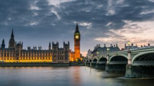 Westminster abbey and big ben in the London skyline at night, London, UK