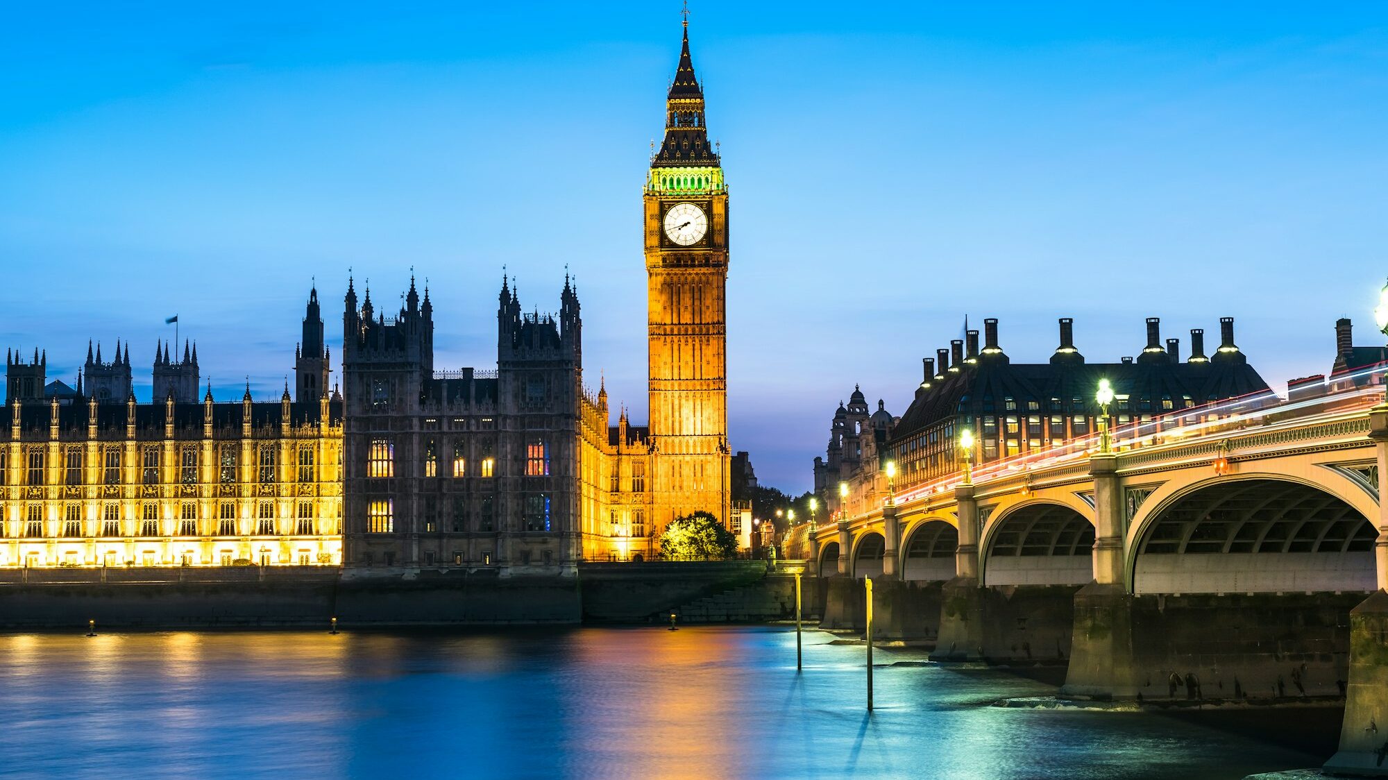 Westminster abbey and big ben in the London skyline at night, London, UK